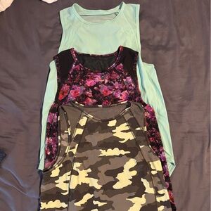 Set of three Lululemon tank tops.